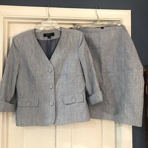 Gently worn, light blue and white pattered skirt and jacket suit, size 14